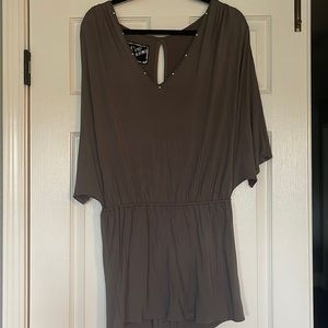 Gorgeous NEW, without tags mini dress with bat wing sleeves and unique details!